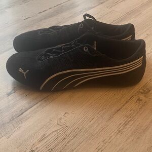 Unisex Men’s 9.5 Puma Black Athletic Shoes with White Stripes